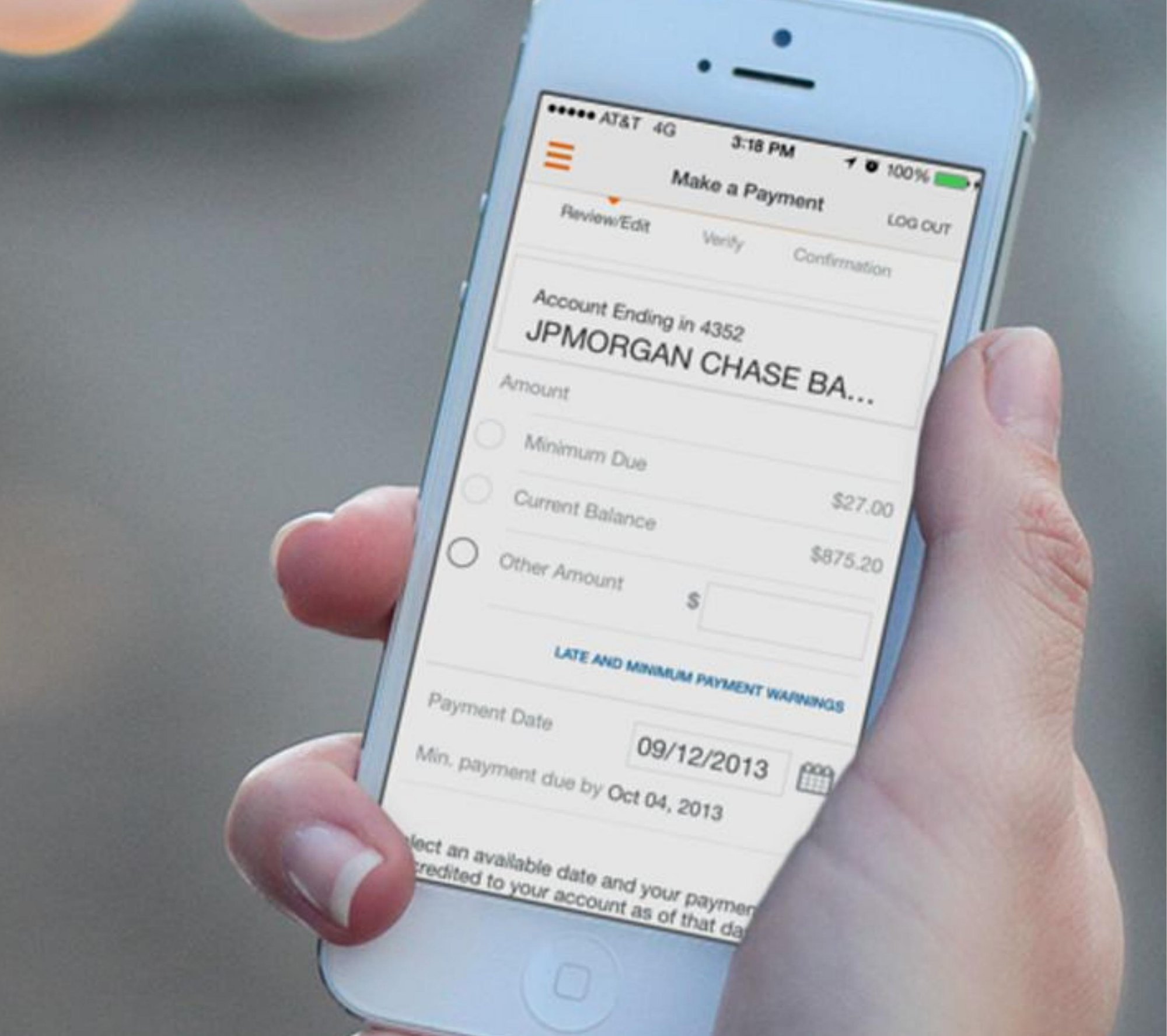 Discover mobile payment flow on iPhone 5, hand-held in low light.